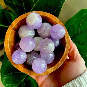 Set of four polished crystal amethyst spheres